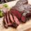 Grilling meat on charcoal barbecue